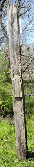 graveboard nailed onto upright